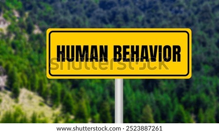 Human behavior message written on yellow metal sign  on nature background. Conceptual human behavior symbol. Copy space.