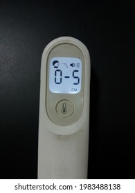 Human Body Temperature Gauge On Black Background