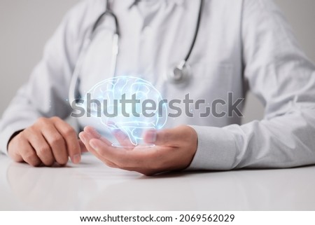 Human brain in the hands of a general practitioner or neurologist. Brain disease and mental illness diagnosis concept photo in neurology, psychiatry, psychotherapy, psychology
