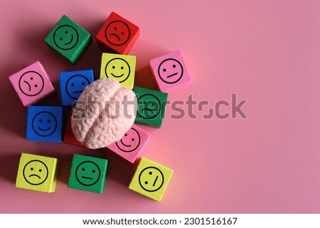 Human brain with happy, neutral and sad icon. Mental health, mood swings, bipolar disorder concept.