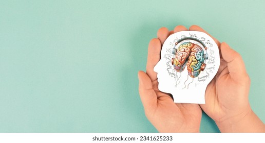 Human brain with headphones and music notes, social media, self care and mental health concept, sound therapy, creative mind - Shutterstock ID 2341625233
