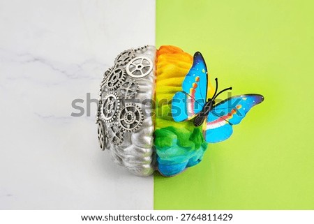 Human brain hemispheres representing logic and creativity with butterfly