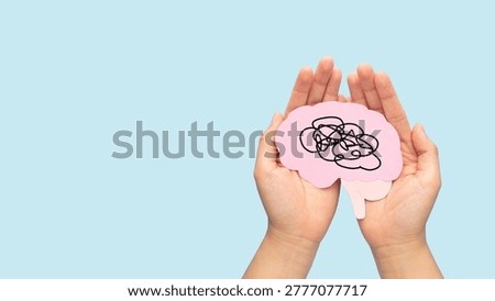 Human brain as tangled messy single line on blue background. Concept of mental disorder, ADHD symptom, finding solution, chaotic thinking process, confused mind. Mental health care.