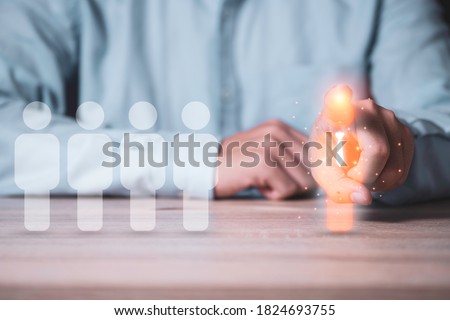 Human development and different thinking concept, Businessman pointing to virtual illustration manager icon  which move to opposite side with white human icons.