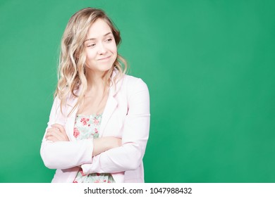 Human emotions, feelings, reaction and attitude. Attractive lady in casual pink classy jacket squeezing eyes and keeping hands crossed looking in doubt and suspicion, feeling sceptic about situation. - Powered by Shutterstock