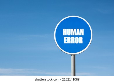 'Human error' sign in blue round frame. Clear sky is on background