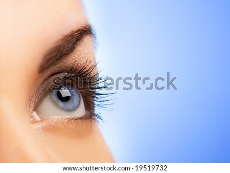 Human eye on blue background (shallow DoF)