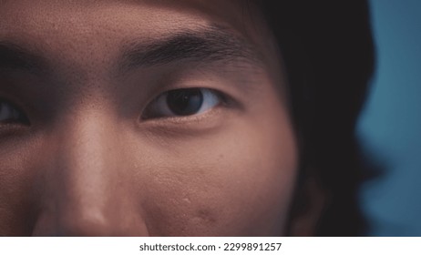 Human eyes of the Asian race. Young beautiful male opens eastern eyes. Extreme close up of an asian man's eyes opening and looking at camera. The awakening of civilization. Ethnicity. Close-up. - Powered by Shutterstock