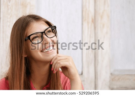 Similar – Image, Stock Photo Rectangular portrait of a young woman in front of a green wall