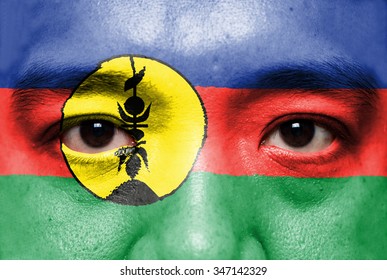 Human Face Painted With Flag Of New Caledonia.

