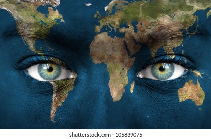 Human face painted with planet earth - "Elements of this image furnished by NASA"