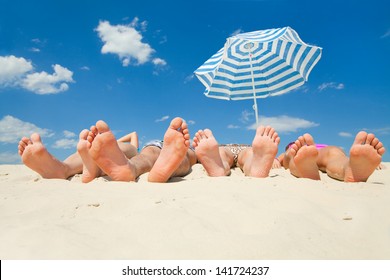 human feet on the sand  beach