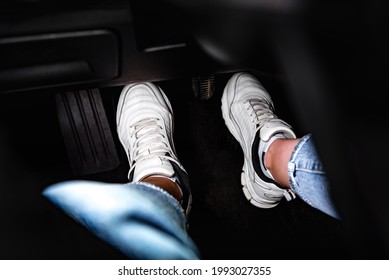 Human Feet Pressing Car Pedal.