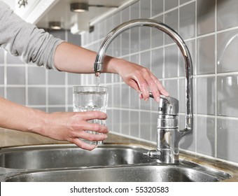 Human Filling A Glass Of Water