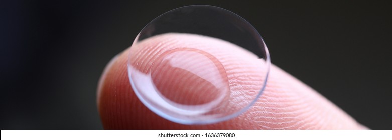 Human Finger Holding Soft Contact Lens Close-up