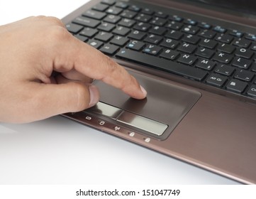 Human finger on the Touchpad and Keyboard - Shutterstock ID 151047749