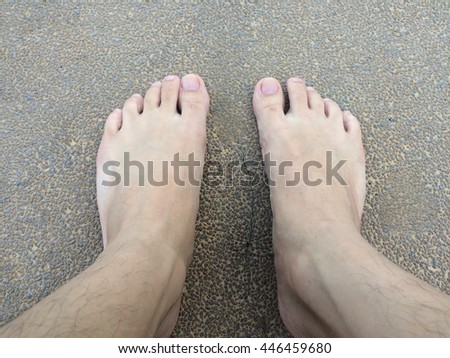 Human foot on concrete floor after swimming.