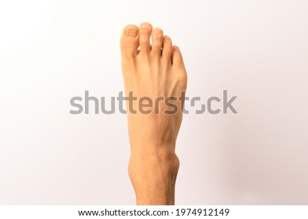 Human foot on white background