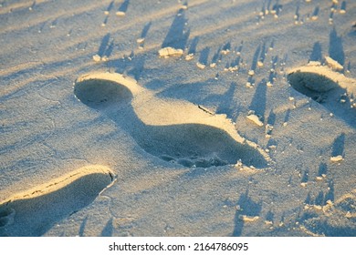 Human Footprings On White Sandy Beach. High Angle View. 