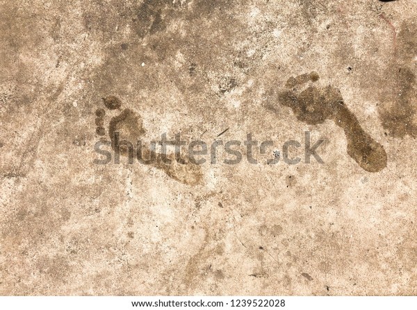 Human\
footprint after step into the wet concreat\
floor