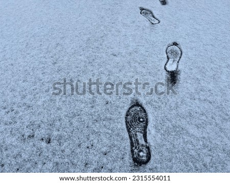 Human footprints on the snow road