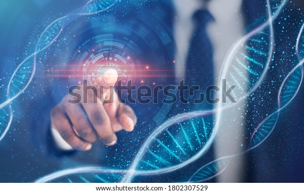 Human genetics research.\
Black businessman touching imaginary screen with DNA spirals,\
collage. Panorama