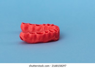 Human Gums Without Teeth Model Medical Implant Isolated On Blue Background. Healthy Teeth, Dental Care And Orthodontic Concept.