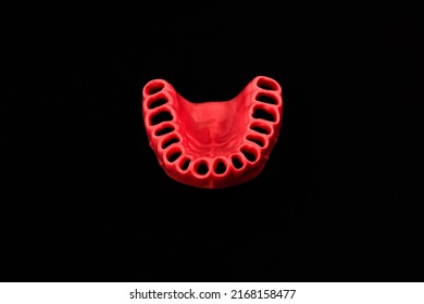 Human Gums Without Teeth Model Medical Implant Isolated On Black Background. Healthy Teeth, Dental Care And Orthodontic Concept.