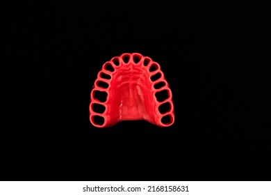 Human Gums Without Teeth Model Medical Implant Isolated On Black Background. Healthy Teeth, Dental Care And Orthodontic Concept.