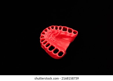 Human Gums Without Teeth Model Medical Implant Isolated On Black Background. Healthy Teeth, Dental Care And Orthodontic Concept.