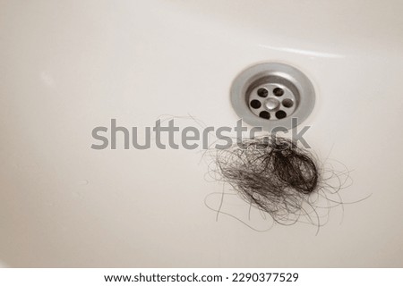 Human hair clogged in sink bathroom  drainage with copy space