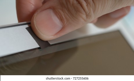 Human Hand Blocks A Webcam Of Laptop By An Adhesive Tape