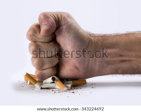 Human hand crushed some cigarettes