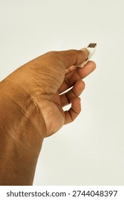 Close‑Up of Human Hand Displaying Flashdisk Memory Device