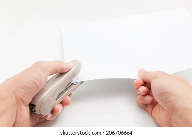 Human Hand Doing A Job With Business Stapler