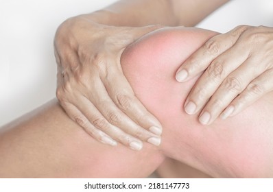 Human Hand Grips The Injured And Painful Leg Muscles Swelling From Knee, Muscle And Bone Inflammation