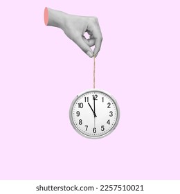 Human hand hold an office clock. Time concept