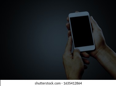 Human hand hold a smartphone with blank screen