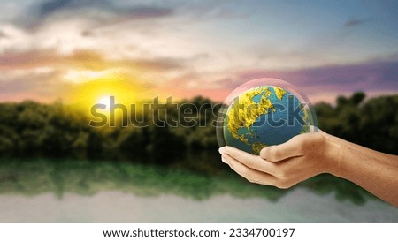 Human hand holding earth with layer protect. World ozone day concept