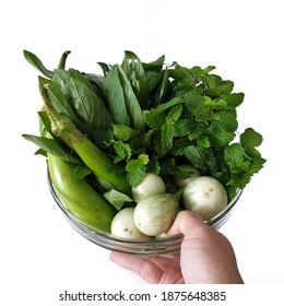 Human Hand Holding Fresh Thai Local Vegetables.