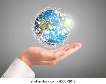 Human hand holding globe Elements of this image furnished by NASA