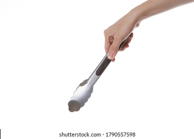 Human Hand Holding Kitchen Tongs On Isolated White Background