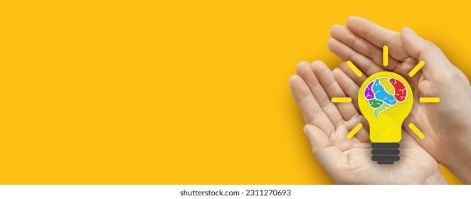 Human hand holding light bulb, colorful human brain smart thinking brainstorming creative idea,creative intelligence mind,education knowledge study and learn,science and innovation - Shutterstock ID 2311270693