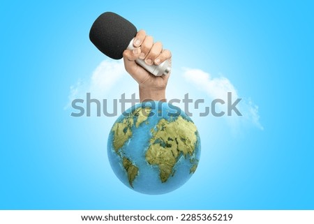 Human hand holding a microphone. World press freedom day concept