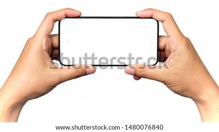 Human hand holding a virtual cell phone is playing game or watching movie on screen, isolated on white background.