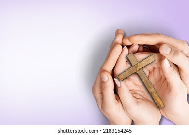 Human Hand Holding Wooden Cross Crucifix. Catholicism, Christianity, Thanksgiving, Catholic And Christian Faith Concept.