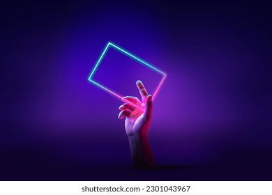 Human hand interacting with geometric glowing figure, rectangle over abstract minimal violet background in neon light. Concept of ultraviolet light, fashion, virtual reality, technologies, ad