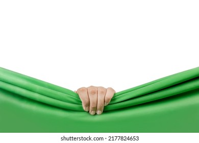 Human hand opening green curtain with white background - Shutterstock ID 2177824653