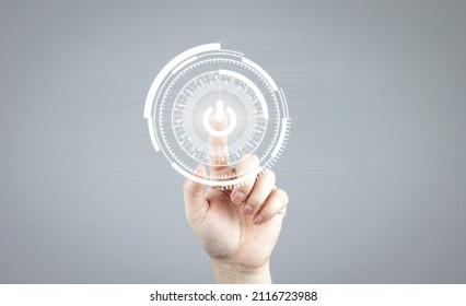 Human hand presses shutdown, power off, or open button icon on grey background. concept of ​stopping the system and a new startup. with copy space and business design