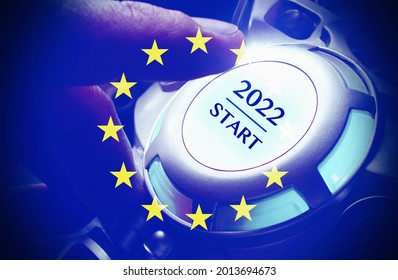 Human Hand Pushing The 2022 Start Button , With The European Flag, Concept Of Starting A New Year .